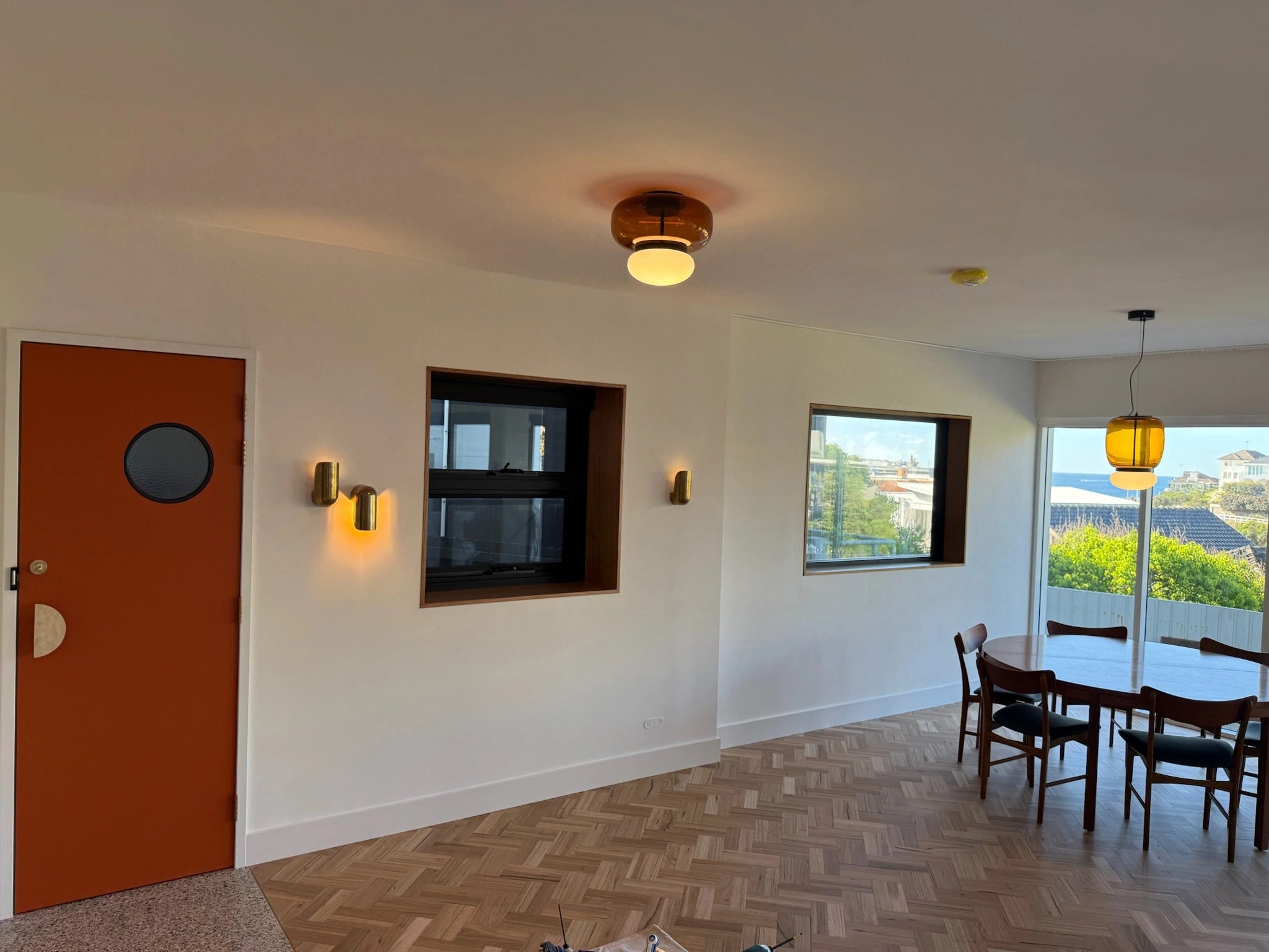 Open dining area with warm pendant lights and modern décor.